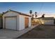 Backyard with detached garage, patio, and string lights at 1614 W Lynwood St, Phoenix, AZ 85007