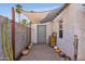 Backyard with a wooden work bench and potted plants at 1614 W Lynwood St, Phoenix, AZ 85007