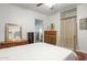 Bedroom with metal bed frame, dresser, and built-in shelving at 1614 W Lynwood St, Phoenix, AZ 85007