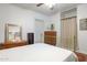 Bedroom with metal bed frame, dresser, and built-in shelving at 1614 W Lynwood St, Phoenix, AZ 85007