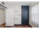 Bedroom with dark blue closet and floating shelves at 1614 W Lynwood St, Phoenix, AZ 85007
