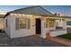 Updated bungalow with string lights and a welcoming entryway at 1614 W Lynwood St, Phoenix, AZ 85007
