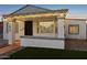 Updated bungalow with string lights and a welcoming entryway at 1614 W Lynwood St, Phoenix, AZ 85007