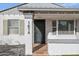 Front entrance with decorative metal gate and security system at 1614 W Lynwood St, Phoenix, AZ 85007