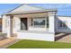 Renovated home exterior featuring a new door and landscaping at 1614 W Lynwood St, Phoenix, AZ 85007