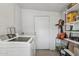 Laundry room with Samsung washer and dryer and extra storage at 1614 W Lynwood St, Phoenix, AZ 85007