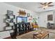Bright living room features hardwood floors, a large TV, and comfortable seating at 1614 W Lynwood St, Phoenix, AZ 85007