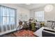 Home office with two bicycles, a desk, and a printer at 1614 W Lynwood St, Phoenix, AZ 85007