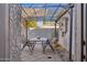 Covered patio with table and chairs, perfect for outdoor dining at 1614 W Lynwood St, Phoenix, AZ 85007