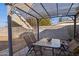Covered patio with table and chairs, perfect for outdoor dining at 1614 W Lynwood St, Phoenix, AZ 85007