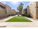 Community courtyard with artificial turf at 1701 W Tuckey Ln # 218, Phoenix, AZ 85015