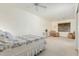 Main bedroom with sitting area and ceiling fan at 17311 N Havasupai Dr, Surprise, AZ 85374