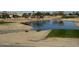 Serene golf course view with pond and mature trees at 17311 N Havasupai Dr, Surprise, AZ 85374