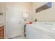 Laundry room with washer, dryer, and storage at 17311 N Havasupai Dr, Surprise, AZ 85374