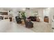 Spacious living room with leather furniture and tile floors at 17311 N Havasupai Dr, Surprise, AZ 85374