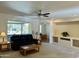 Relaxing living room features a ceiling fan and comfortable seating at 17311 N Havasupai Dr, Surprise, AZ 85374