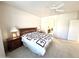 Bright main bedroom with ensuite bathroom access and ceiling fan at 17311 N Havasupai Dr, Surprise, AZ 85374