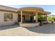 Covered patio with hot tub and seating area at 17311 N Havasupai Dr, Surprise, AZ 85374
