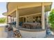 Covered patio with hot tub and seating area at 17311 N Havasupai Dr, Surprise, AZ 85374