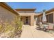 Patio area with seating for four and a shaded umbrella at 17311 N Havasupai Dr, Surprise, AZ 85374