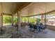 Covered patio with hot tub and seating area at 17311 N Havasupai Dr, Surprise, AZ 85374