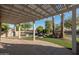 Outdoor kitchen and patio area with pergola and fire pit at 17901 W Tierra Del Sol Dr, Surprise, AZ 85387