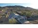 Aerial view of single story home with two car garage and mountain views at 1805 W Piedmont Rd, Phoenix, AZ 85041