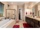 Bathroom with double vanity, soaking tub and walk-in shower at 1819 W Magdalena Ln, Phoenix, AZ 85041