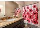 Bathroom with granite countertop and floral shower curtain at 1819 W Magdalena Ln, Phoenix, AZ 85041