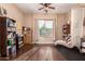 Bright bedroom with built-in shelving and chaise lounge at 1819 W Magdalena Ln, Phoenix, AZ 85041