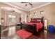 Main bedroom with king-size bed and dark wood furniture at 1819 W Magdalena Ln, Phoenix, AZ 85041
