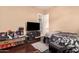 Bedroom with a double bed and entertainment center at 1819 W Magdalena Ln, Phoenix, AZ 85041