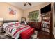 Bright bedroom with comfortable bed and built-in shelving at 1819 W Magdalena Ln, Phoenix, AZ 85041