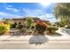 Landscaped front yard with desert plants and a large driveway at 1819 W Magdalena Ln, Phoenix, AZ 85041