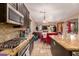 Kitchen with granite counters, gas stove, and view of dining area at 1819 W Magdalena Ln, Phoenix, AZ 85041