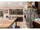 Kitchen features granite island and stainless steel appliances at 1819 W Magdalena Ln, Phoenix, AZ 85041