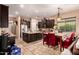 Modern kitchen with dark cabinetry, granite countertops, and an island at 1819 W Magdalena Ln, Phoenix, AZ 85041