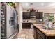 Spacious kitchen with granite countertops and dark wood cabinetry at 1819 W Magdalena Ln, Phoenix, AZ 85041