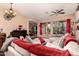 Spacious living room with sectional sofa, large windows, and a piano at 1819 W Magdalena Ln, Phoenix, AZ 85041