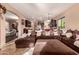 Open living room with a comfortable sectional sofa and views into the kitchen at 1819 W Magdalena Ln, Phoenix, AZ 85041