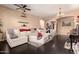 Open living area with a large sectional sofa and dark hardwood floors at 1819 W Magdalena Ln, Phoenix, AZ 85041