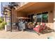 Outdoor patio with spiral staircase, seating area, and covered structure at 1819 W Magdalena Ln, Phoenix, AZ 85041