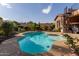 Stunning kidney-shaped pool with a view of the house and landscaping at 1819 W Magdalena Ln, Phoenix, AZ 85041