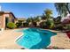 Inviting kidney shaped pool in a sunny backyard setting at 1819 W Magdalena Ln, Phoenix, AZ 85041
