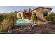 Relaxing kidney-shaped pool with surrounding landscaping and patio at 1819 W Magdalena Ln, Phoenix, AZ 85041