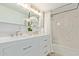 Stylish bathroom featuring a double vanity and a large mirror at 1934 E Monte Vista Rd, Phoenix, AZ 85006