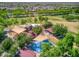 Aerial view of neighborhood park with playground and shaded areas at 20226 N 260Th Dr, Buckeye, AZ 85396