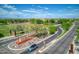 Aerial view of community featuring park, roads, and homes at 20226 N 260Th Dr, Buckeye, AZ 85396