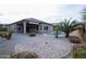 Spacious backyard features a covered patio, sparkling pool, desert landscaping, and ample room for outdoor entertaining at 20226 N 260Th Dr, Buckeye, AZ 85396