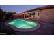 Illuminated pool at dusk, perfect for evening swims at 20226 N 260Th Dr, Buckeye, AZ 85396